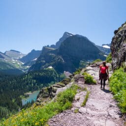Hiker Walking Along Mountain Trail in Glacier National Park